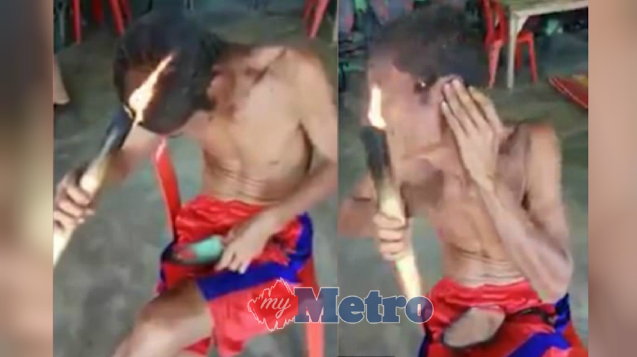 RAKAMAN video yang menunjukkan seorang lelaki memotong rambut menggunakan api. FOTO Liveleak