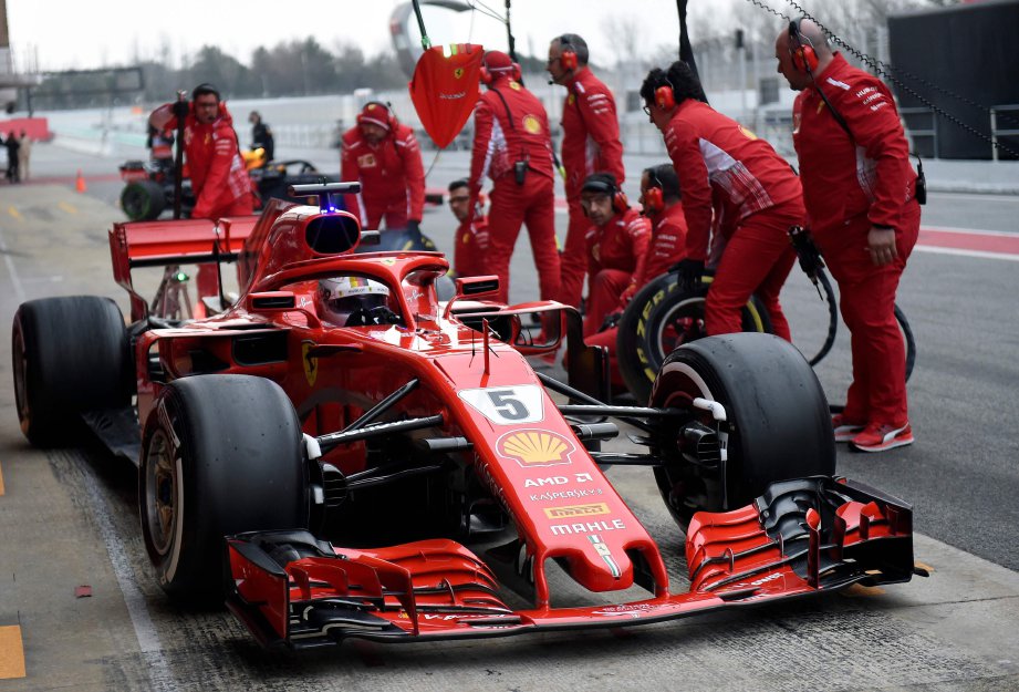 PEMANDU Ferrari, Vettel ketika sesi ujian pramusim di Circuit de Catalunya. - FOTO AFP