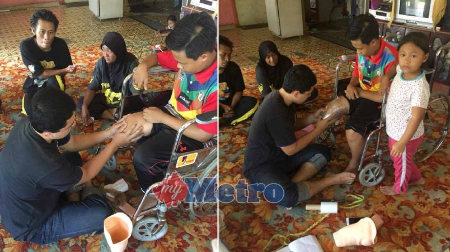 MUHAMMAD Daniel  Haikal Hasdi, 14 menjalani proses mengukur kaki palsu yang disumbangkan Syarikat Kedidi Kaki Palsu di Kampung Batu Lapan, Lepar. FOTO Mohd Rafi Mamat