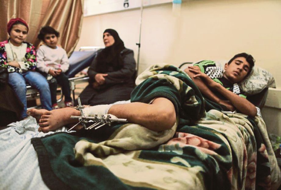 Bassel al-Helo dirawat di Hospital Shifa di Gaza. - AFP