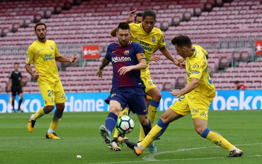 PENYERANG Barca, Lionel Messi (tengah) pernah mencetus fenomena dalam LaLiga. FOTO/AFP 