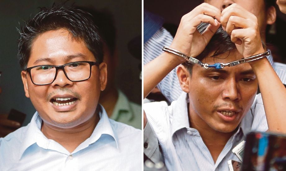WA Lone (kiri) dan Kyaw Soe Oo (kanan) di luar mahkamah selepas dijatuhkan hukuman penjara tujuh tahun. - EPA