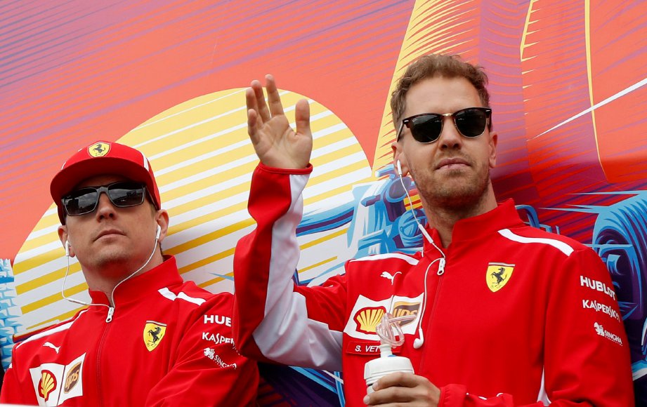 PEMANDU Ferrari, Kimi Raikkonen (kiri) dan Sebastian Vettel. - Foto REUTERS