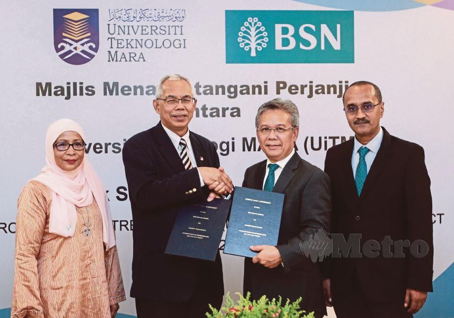 YUNOS (dua dari kanan) dan Naib Canselor UiTM, Prof Dr Mohd Azraai Kassim (dua dari kiri)  pada majlis  menandatangani perjanjian bersama BSN-UiTM. FOTO Sairien Nafis 