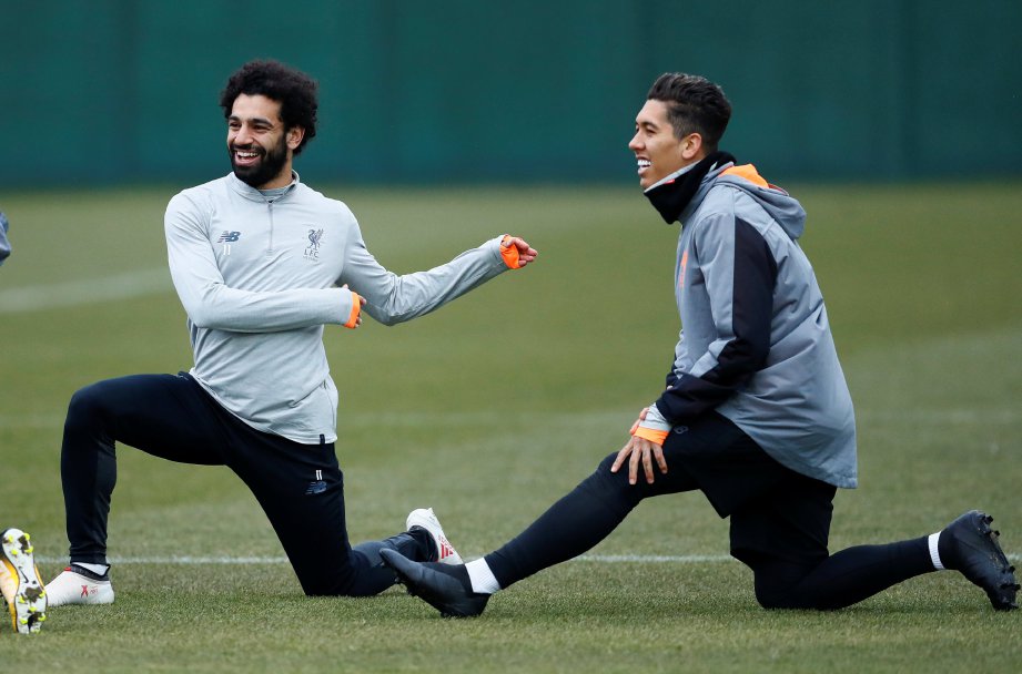 MOHAMED Salah dan Firmino (kanan) antara tonggak Liverpool. - FOTO REUTERS
