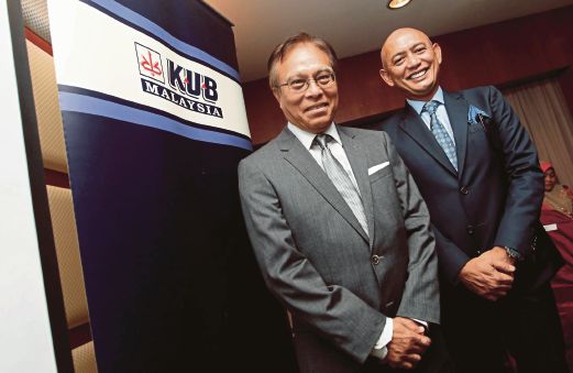 ABDUL Rahim (kanan) bersama Pengerusi KUB Malaysia, Datuk Ahmad Ibnihajar.
