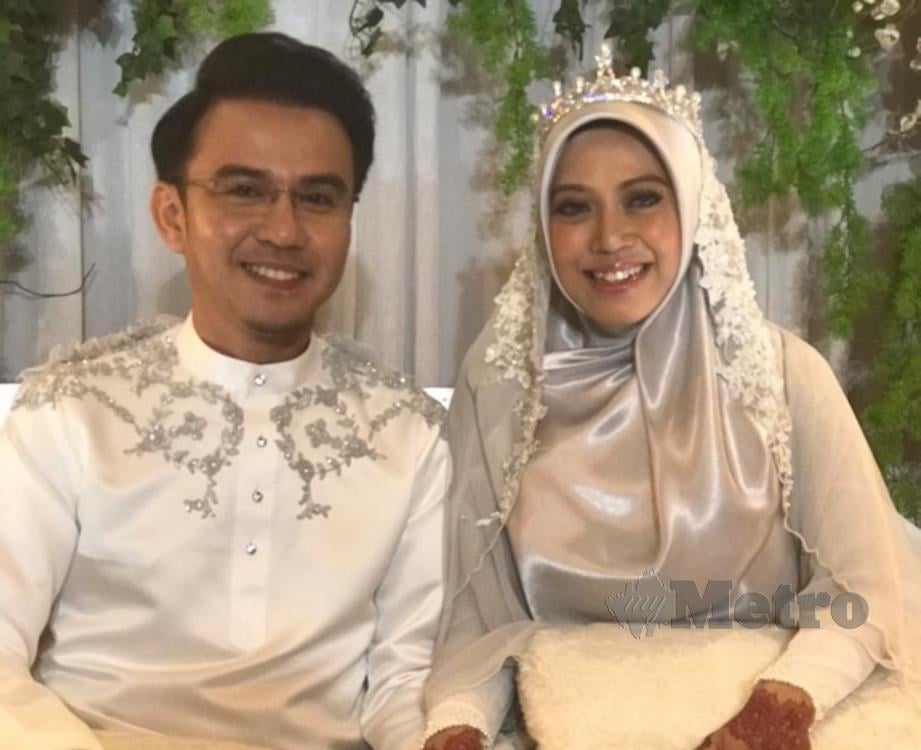 FITRI Haris bersama isterinya, Fazilah Omar.