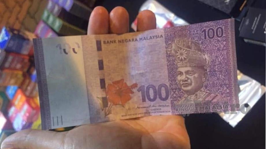 Wang RM100 yang diterima peniaga didakwa palsu. FOTO Mohd Khidir Zakaria