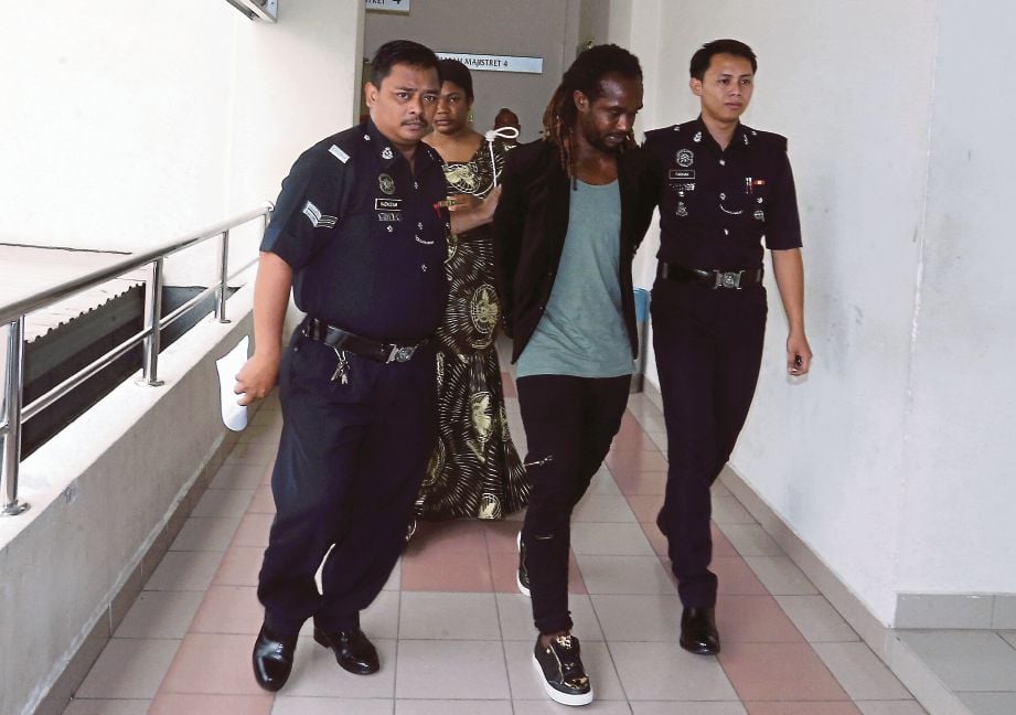 FORKEY Doe (tengah) dihukum denda RM6,000 oleh Mahkamah Majistret Petaling Jaya, semalam. 