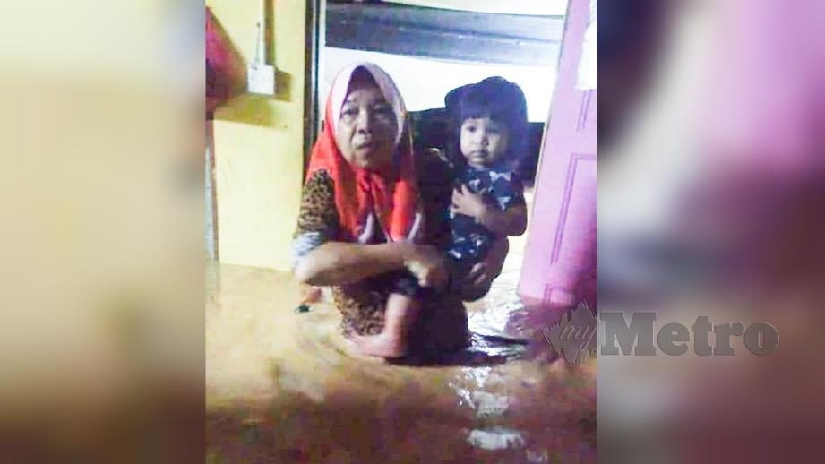 NORIZAN Awang, 48, sempat menyelamatkan anak perempuannya yang terperangkap dalam kejadian banjir kilat di Kampung Tanah Puteh. FOTO Ihsan Pembaca