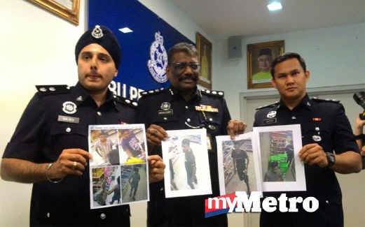 MUNUSAMY (tengah) menunjukkan imej suspek yang diperoleh daripada rakaman CCTV. FOTO Zulfadhli Zulkifli