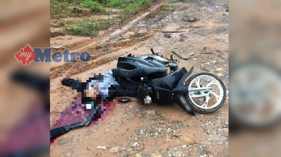 MANGSA ditemui dengan kesan tembakan di leher selepas dipercayai tertembak diri sendiri di Kampung Lepan Anjung, Dabong, Kuala Krai. FOTO Ihsan pembaca