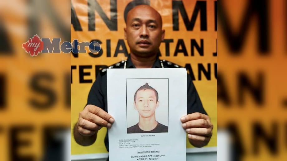 KETUA Jabatan Siasatan Jenayah Terengganu, Asisten Komisioner Fazlisyam Abdul Majid menunjukkan suspek yang dikenali sebagai Alliman Hanafi, 25, dari Padang Nenas, Kuala Nerus. FOTO Ghazali Kori