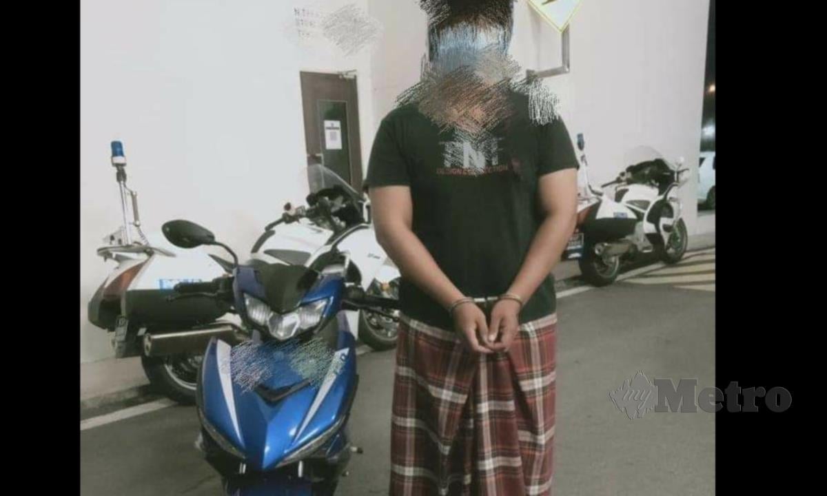 Salah seorang suspek yang ditahan hanya mengenakan kain pelekat sahaja ketika melakukan aksi tunggangan berbahaya di KM10 hingga KM15 Jalan Kuala Perlis-Changlun, Kangar. FOTO IHSAN PDRM PERLIS