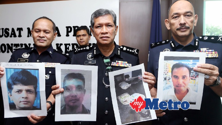 ASRI (tengah) menunjukkan gambar mangsa yang dibunuh manakala pegawainya memegang gambar suspek yang dikehendaki iaitu Nur (gambar kiri) dan Zul (gambar kanan). FOTO Amran Hamid