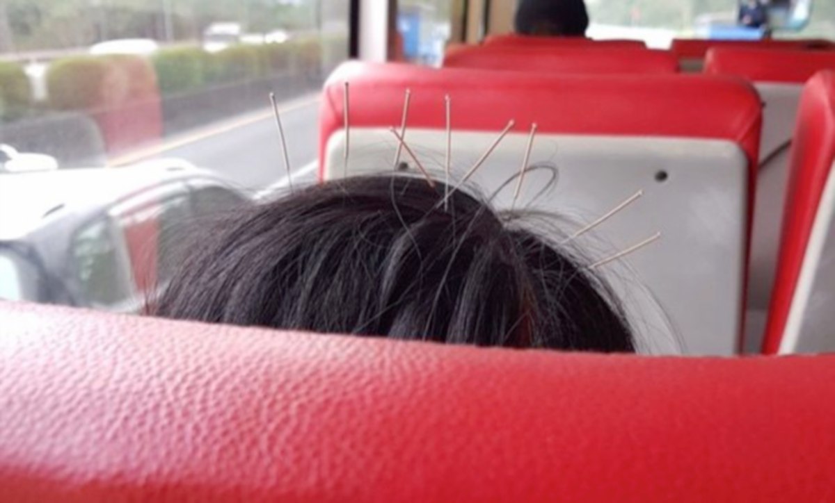 AKSI wanita yang menaiki bas dengan sembilan jarum di kepalanya. FOTO Agensi 