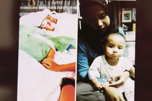 GAMBAR Sharina yang menjadi viral di media sosial memangku  Mohd Harraz  kini dalam keadaan koma dan dirawat di ICU HRPZ II sejak seminggu lalu. 