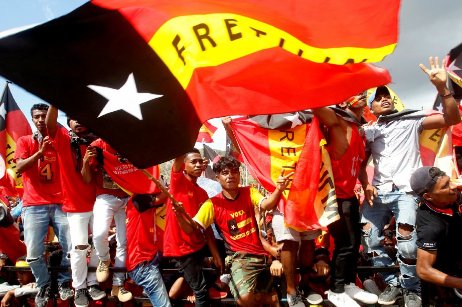 RAKYAT Timor Leste meraikan keputusan pilihan raya. FOTO/AFP 