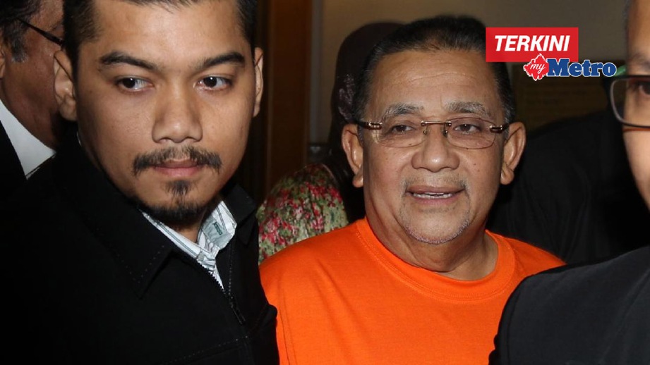 PEGAWAI SPRM membawa Isa untuk permohonan tahanan reman di Mahkamah Majistret Putrajaya. FOTO Mohd Fadli Hamzah
