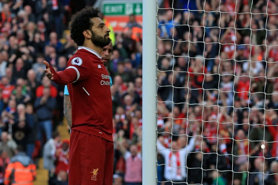 REAKSI Mohamed Salah selepas ledak gol kedua Liverpool ketika menentang Bournemouth di Anfield. - Foto AFP