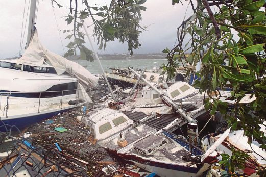 BEBERAPA bot yang rosak di Port Vila, ibu negara Vanuatu selepas puting beliung Pam membadai negara pulau itu.   