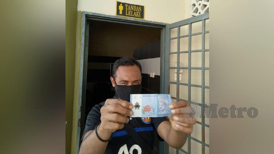 HELMI Mahmood hasil RM1 yang diperoleh sehari PKP. FOTO Ahmad Ismail