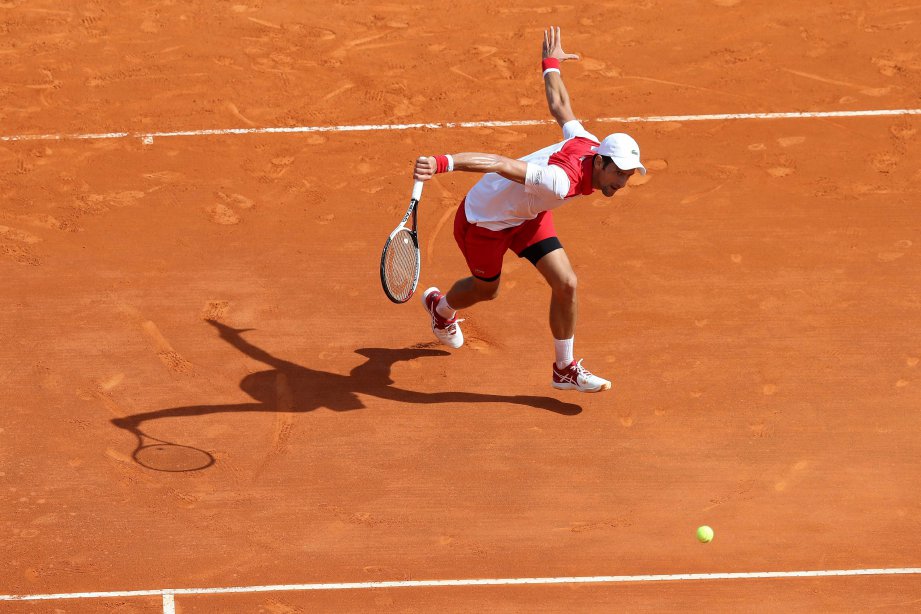 AKSI Novak Djokovic ketika menentang Dusan Lajovic. - Foto AFP
