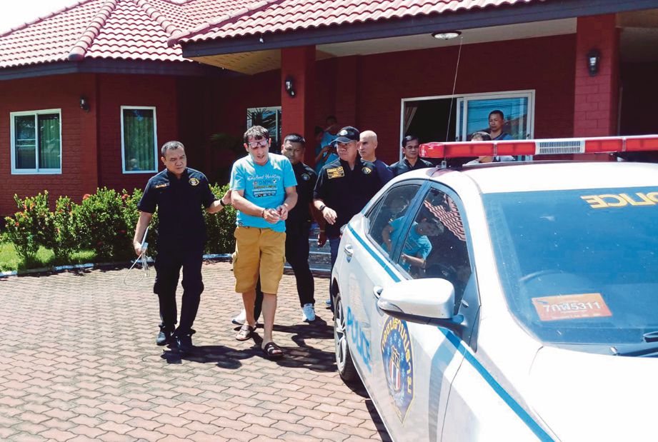 FRANCESCO ditahan polis di sebuah rumah mewah di Pattaya kerana disyaki menyamar sebagai George Clooney dan menipu. FOTO AFP