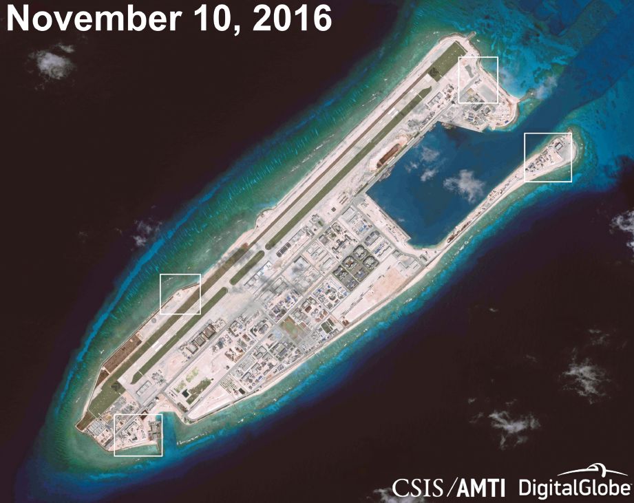 GAMBAR satelit menunjukkan China menempatkan aset ketenteraan di pulau buatannya.