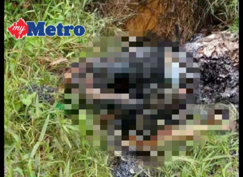 Mayat wanita dalam keadaan terbakar yang ditemui di tempat pembuangan sampah di Taman Putri, Kulai, kelmarin. FOTO ihsan pembaca