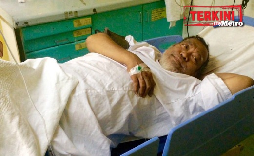 FAUZI cedera ditetak ketika bergelut dengan penjenayah. FOTO Shahrul Redzuan Zulkifli