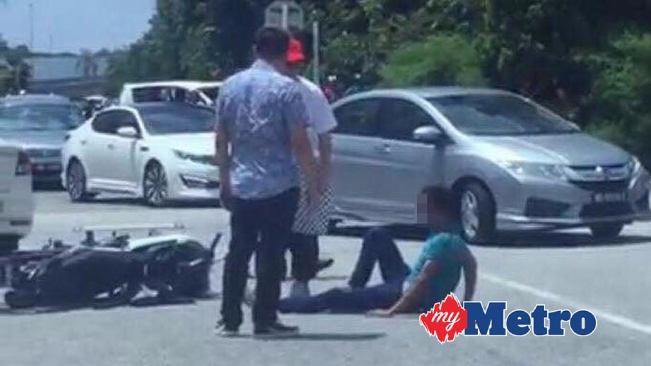 SUSPEK ditahan orang awam selepas cuba meragut seorang wanita di Jalan Puteri, Puchong, Serdang. FOTO ihsan Polis