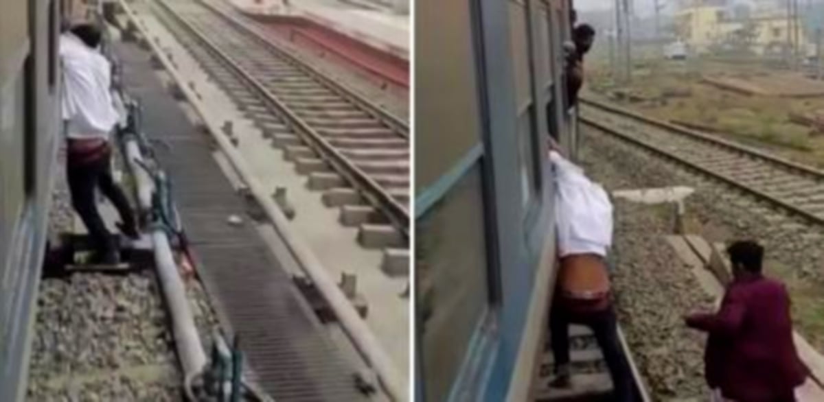 LELAKI  tergantung di tepi gerabak kereta api selepas ditangkap mencuri telefon bimbit. FOTO Instagram.