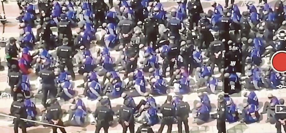 RAKAMAN video yang tular menunjukkan ratusan lelaki yang ditutup mata, digari dikumpulkan di stesen kereta api. - Agensi