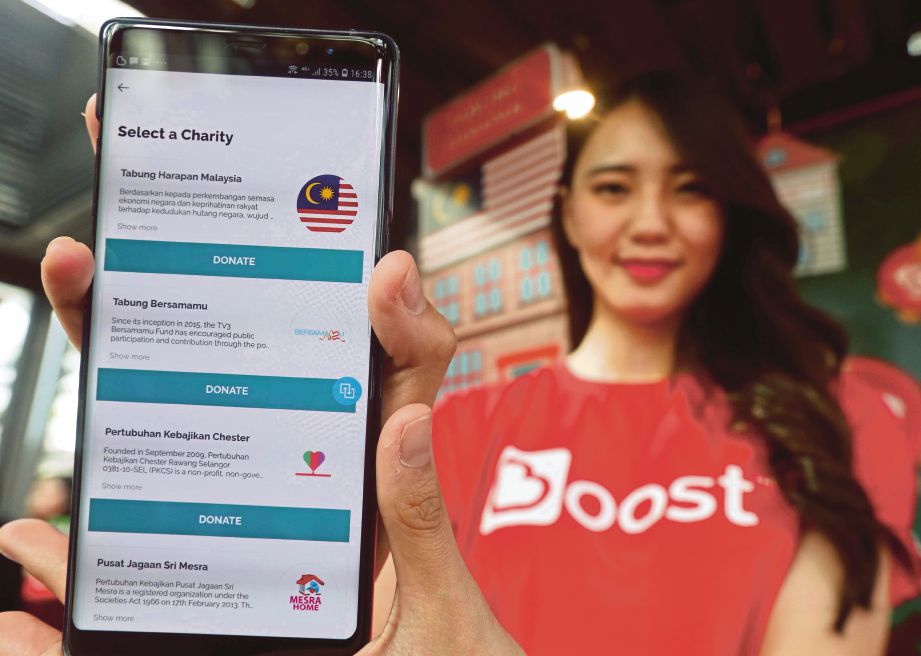 MODEL menunjukkan ciri-ciri aplikasi Boost di Kuala Lumpur.
