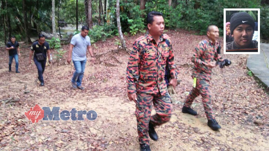 ANGGOTA bomba dan penyelamat menjalankan operasi mencari dan menyelamat Muhammad Shahrul Nizam (gambar kecil) yang dilaporkan sesat di Gunung Chemendung. FOTO Adnan Ibrahim