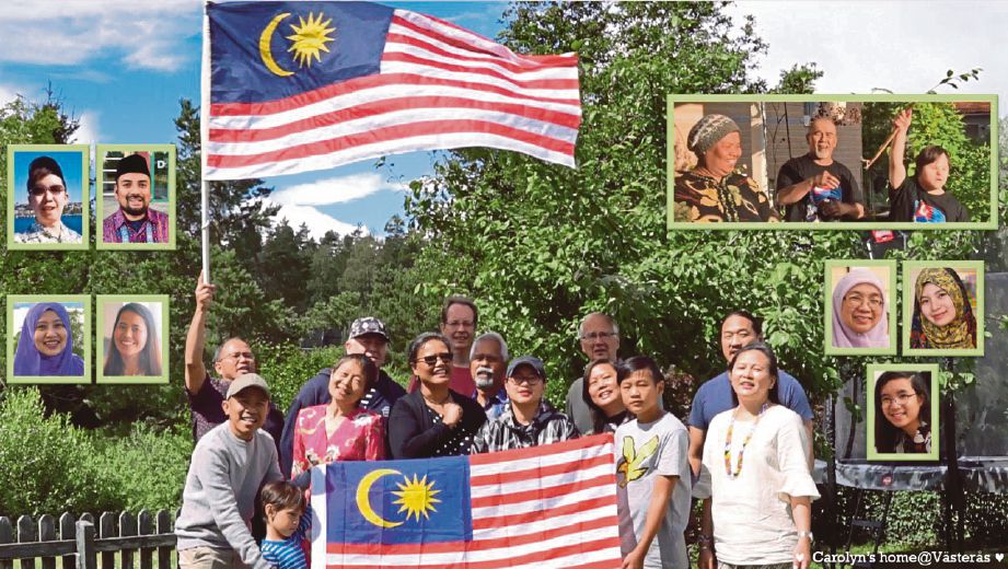 ZAINAL (pegang bendera kiri) bersama rakyat Malaysia di Sweden menghasilkan video nyanyian sempena Hari Kebangsaan. 