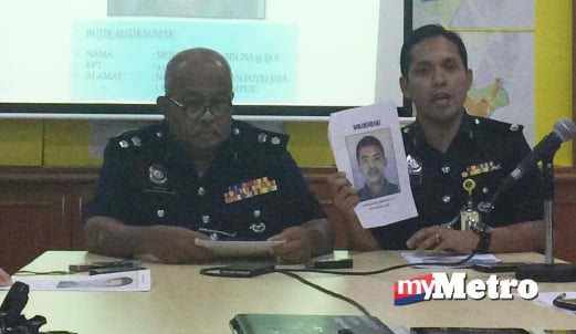 Ketua Bahagian Siasatan Jenayah Ibu Pejabat Polis Daerah Sepang ASP Mohd Iqbal Ibrahim menunjukkan gambar suspek yang dicari. FOTO Hayati Ibrahim