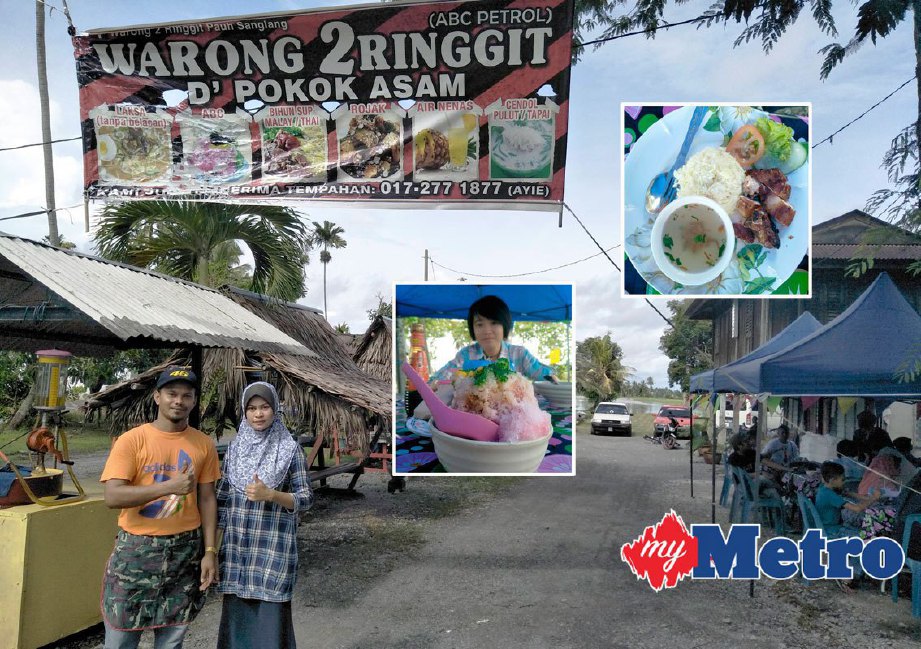 Razali dan Siti Khazanah di gerai Warong 2 Ringgit D'Pokok Asam milik mereka di Kampung Pauh, Sanglang. FOTO DZIYAUL AFNAN ABDUL RAHMAN