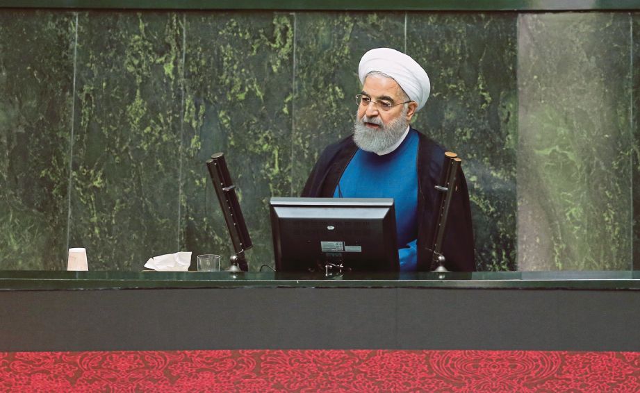 HASSAN   ketika berucap di Parlimen di Tehran semalam. - AFP