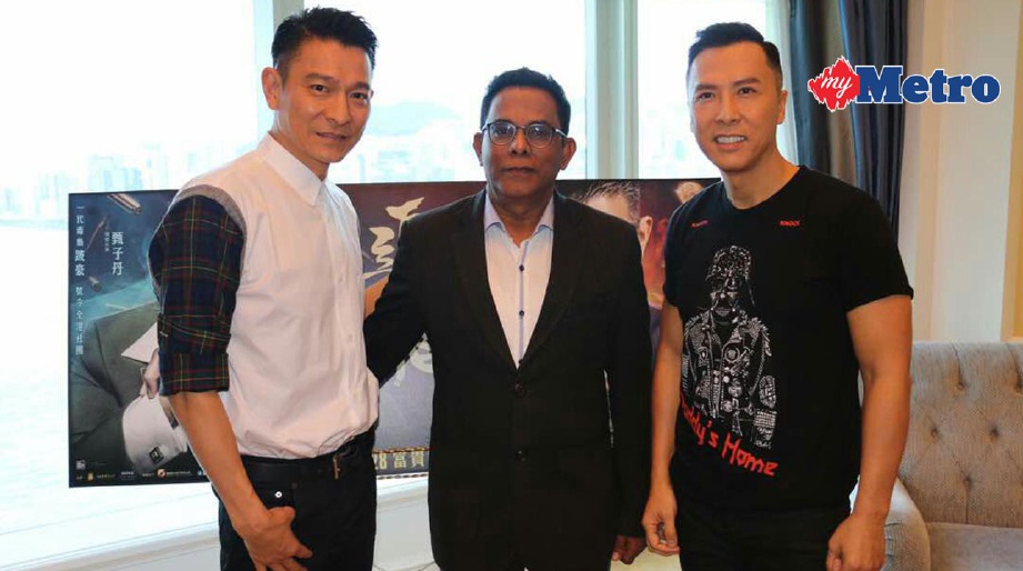 Pengarah Lotus Five Star (LFS), Garuna Murthee (tengah) selaku pengedar filem itu di Malaysia bersama Andy (kiri) dan Donnie. FOTO SDT 
