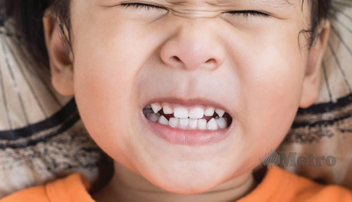 KEADAAN kanak-kanak ketika mengetap gigi.
