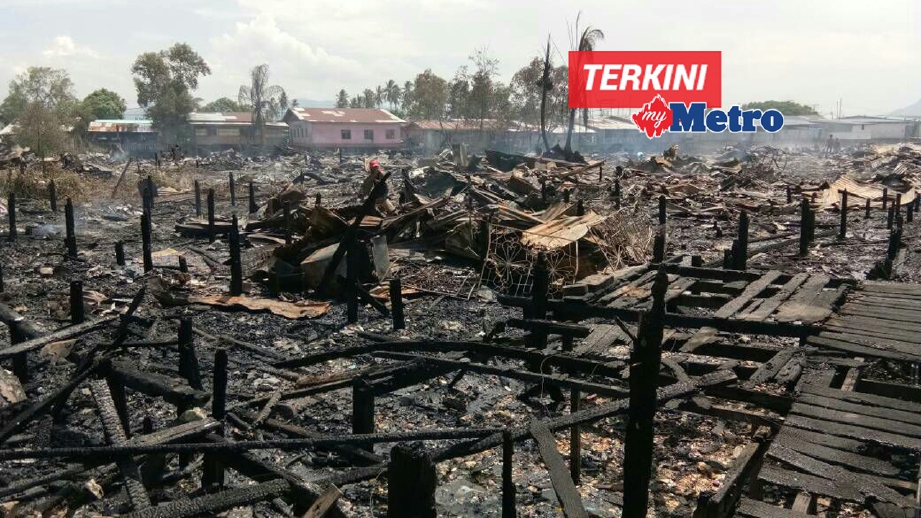 KEBAKARAN yang memusnahkan 60 rumah di Kampung Titingan, Tawau. FOTO Nasrawati Syarifuddin