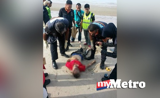 PASUKAN forensik memeriksa mayat seorang lelaki ditemui terdampar di Pantai Saujana, Batu 4. FOTO Mohd Khidir Zakaria