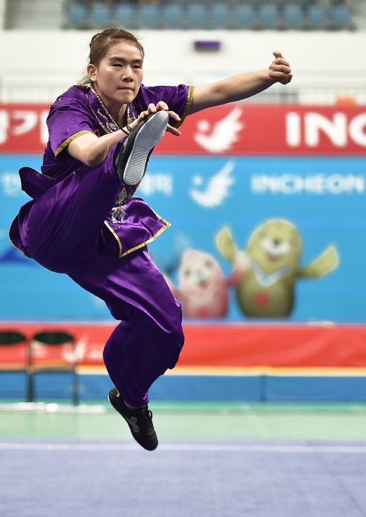CHEAU Tai beraksi ketika final acara nanquan di Sukan Asia. FOTO AFP