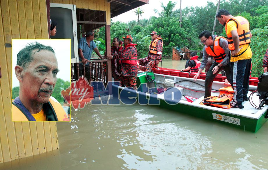Beberapa anggota Skim Rondaan Sukarela (SRS) Meranti, Pasir Mas bersama anggota Bomba dan Penyelamat membantu menyelamat mangsa banjir membabit 15 kampung di Dewan Undangan Negeri (DUN) Meranti. (Gambar kecil) Abdul Hadi. FOTO Syamsi Suhami