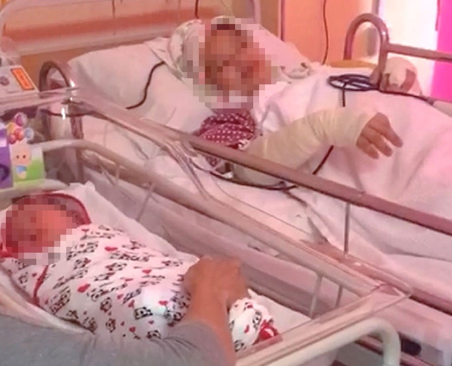 KEADAAN seorang guru wanita dan anaknya yang dilahirkan selepas pembedahan akibat ditikam suaminya di Hospital Putrajaya.