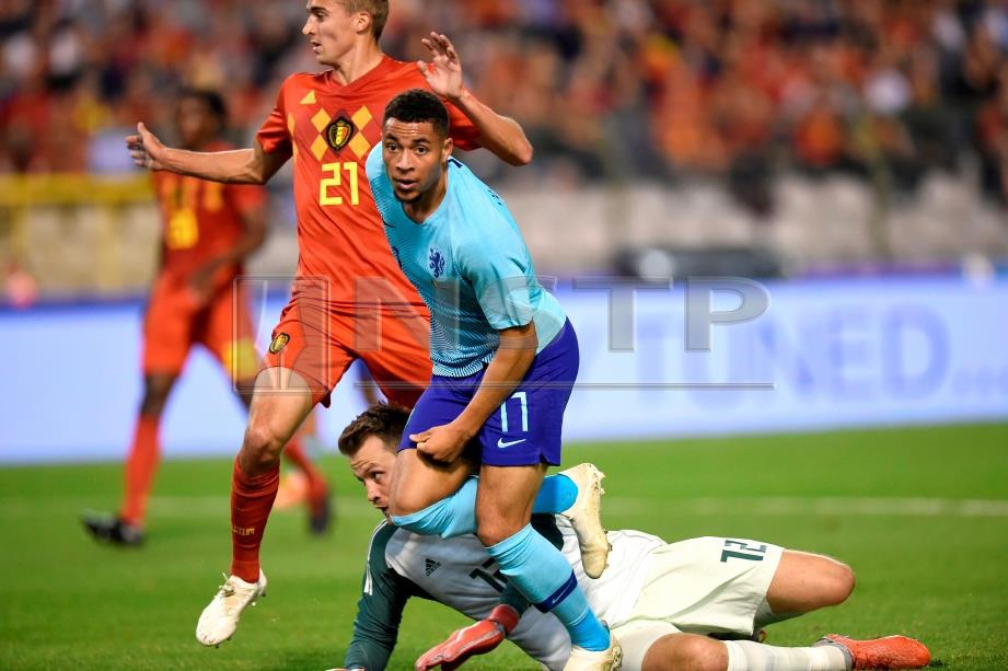 GROENEVELD (tengah) ketika meraikan gol ketika menentang Belgium. FOTO/AFP   