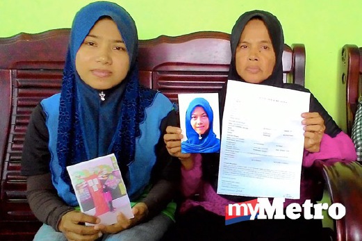 MAIZUN (kanan) dan anaknya, Nur Fazlina Zainol, 27, menunjukkan salinan laporan polis serta gambar Maisarah yang hilang. FOTO Bernama
