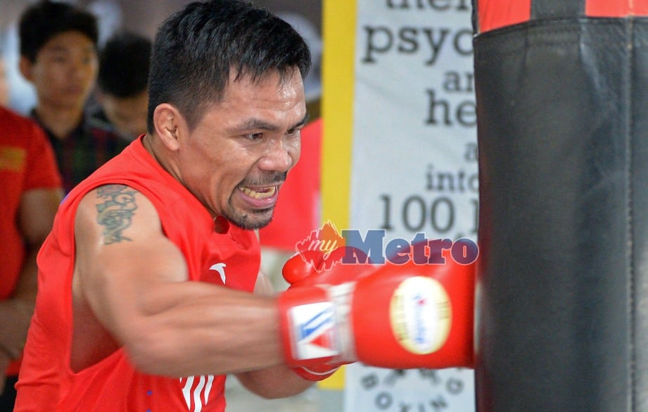 PENINJU Filipina, Manny Pacquiao menjalani latihan menjelang pertarungan dengan peninju Argentina, Lucas Matthysse. FOTO  AFP